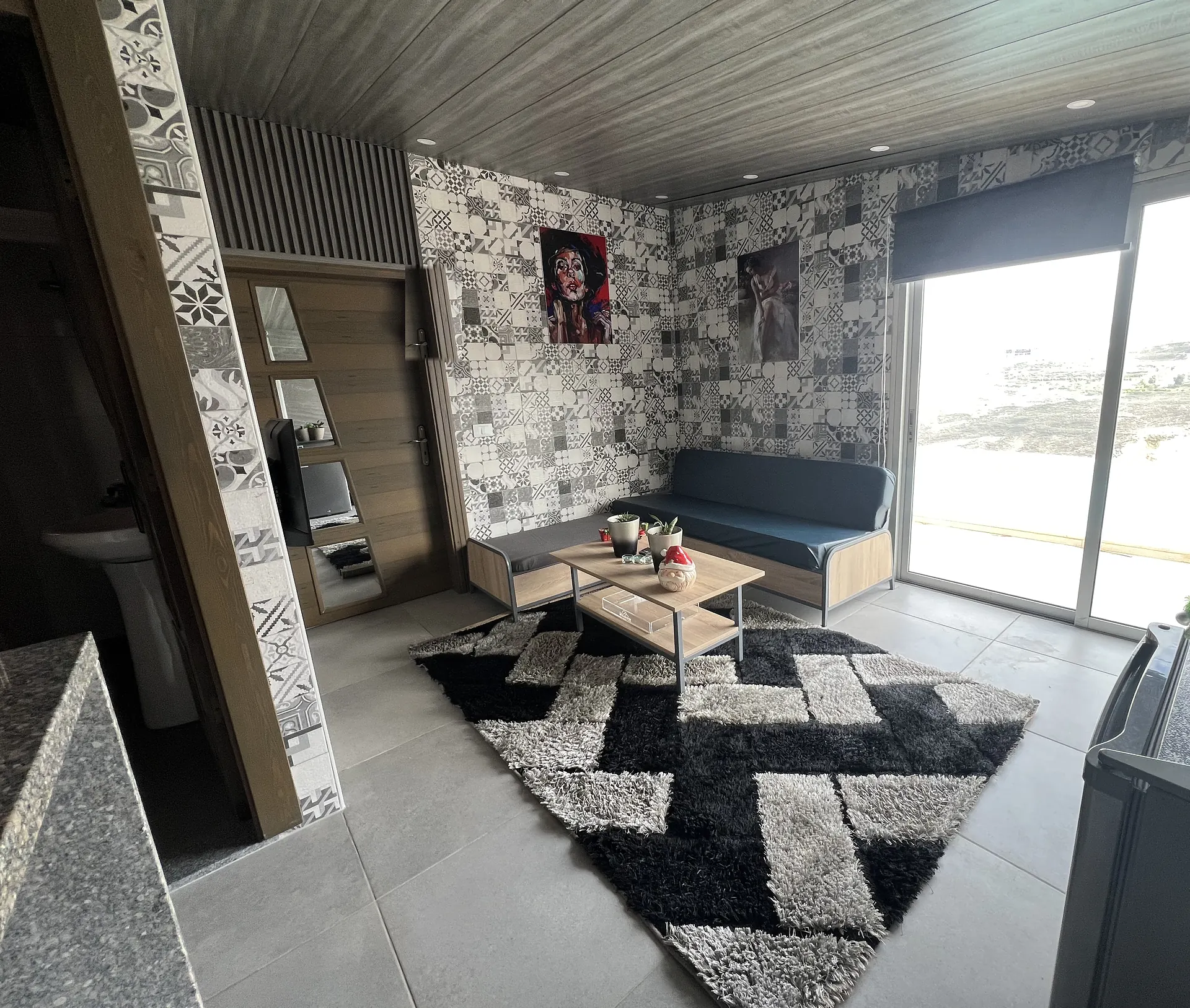 The living area, with the sliding window looking out over the valley
